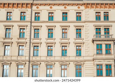 A close-up view of a historic building facade in Budapest, Hungary, showcasing its detailed stonework and arched windows. Perfect for travel and architecture photography. - Powered by Shutterstock