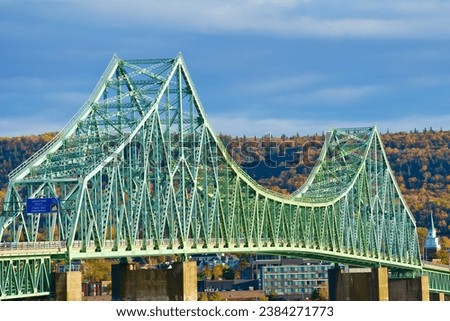 Closeup view of historical steel deck-truss bridge over Restigouche river New Brunswick Canada
