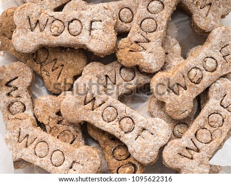 Close-up view of home made dog treats with the word Woof