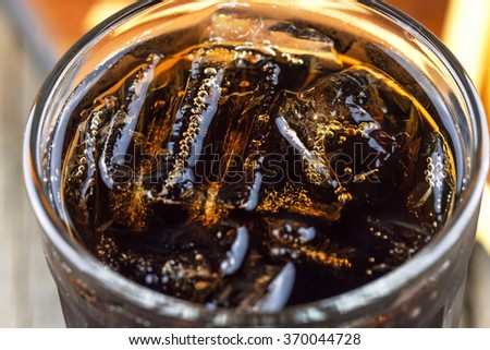 Close-up view of ice in a cola
