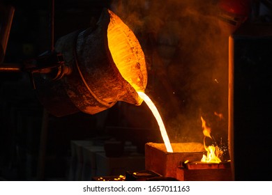 Close-up view of industrial chill casting. The process of for filling out mold with molten metal. - Powered by Shutterstock