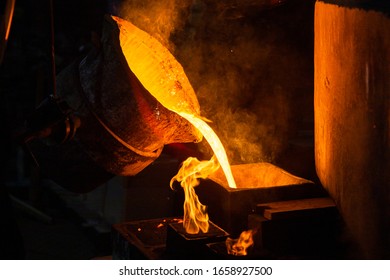 Close-up view of industrial chill casting. The process of for filling out mold with molten metal. - Powered by Shutterstock