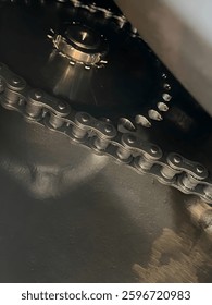 A close-up view of interconnected gears, chain, and pulley in an engine system. Precision and power in motion, showcasing the beauty of mechanical engineering. #Engineering #MachineParts