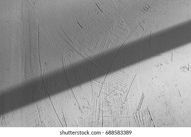 close-up view of light and shadow on gray concrete wall textured background