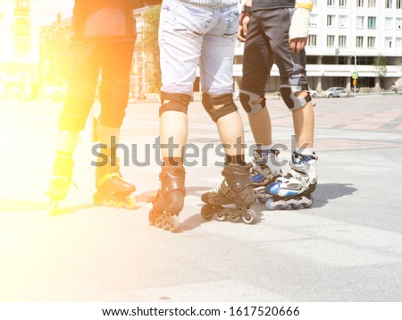 Close-up view of male legs in roller skates. Figure skating on roller skates.