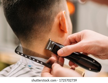 Close-up View Of Man Getting A Haircut