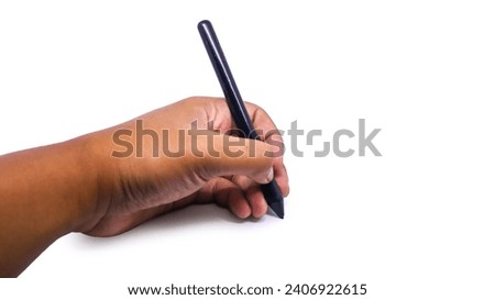 Close-up view of a man's hand holding a black tablet pen or smartpen or drawing pen in a writing pose. isolated on white background. Modern pen technology.
