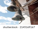 Close-up view of metal orthodox church bells. Bottom view of the Church bells