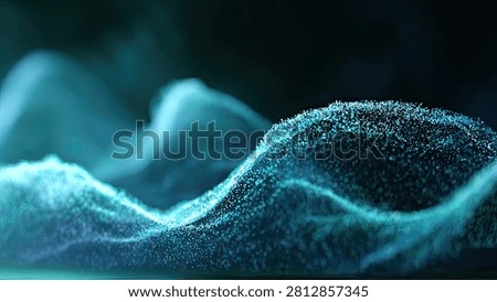 Close-up view of microscopic blue particles forming undulating waves and sharp peaks, illuminated with a soft glow against a dark background.
