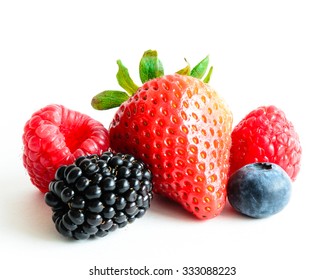 Close-up view of mixed, assorted berries blackberry, strawberry, blueberry, raspberry isolated on white background. Colourful and healthy concept. Black, blue, red, green color