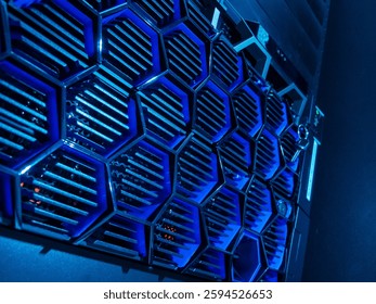 A close-up view of a modern computer server featuring a striking hexagonal design with blue lighting, showcasing advanced technology and sleek hardware.