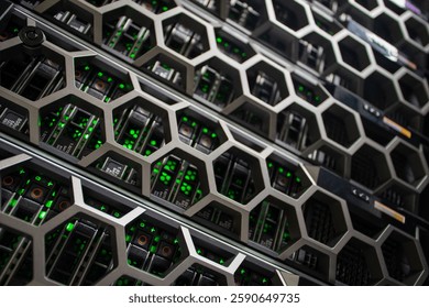 A close-up view of a modern data center rack featuring a unique honeycomb design with vibrant green lights, showcasing advanced computing technology and efficient system management.