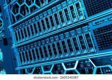 A close-up view of a modern data center server rack featuring illuminated components and advanced technology showcasing digital storage solutions and infrastructure.