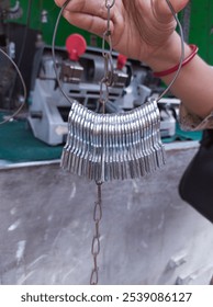 A close-up view of a modern duplicate key-making machine in use, showcasing the intricate process of key cutting in Kolkata.