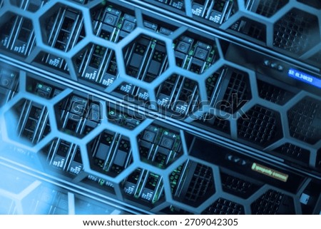 Close-up view of modern server hardware in a data center. The image showcases the intricate design and technology used for data storage and management.