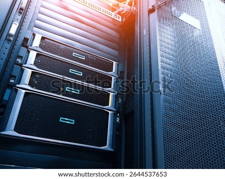 A close-up view of modern server rack units in a data center, showcasing advanced technology and organized hardware for efficient data processing and storage.