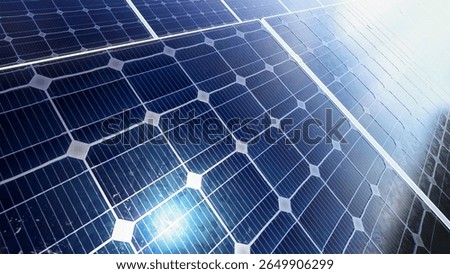 Close-up view of multiple solar panels generating clean renewable energy. Suitable for topics on sustainability, innovation, and modern energy solutions.