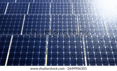 Close-up view of multiple solar panels generating clean renewable energy. Suitable for topics on sustainability, innovation, and modern energy solutions.