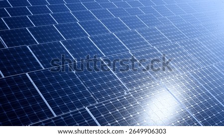 Close-up view of multiple solar panels generating clean renewable energy. Suitable for topics on sustainability, innovation, and modern energy solutions.
