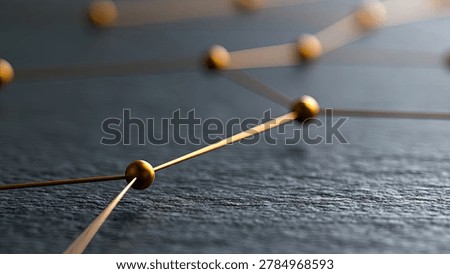 Close-up view of a network of thin golden lines connecting small golden spheres on a dark, textured background, suggesting connectivity and data flow.