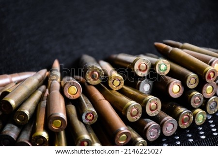 Closeup view of the old bullets on dark background, soft and selective focus on bullet butts.