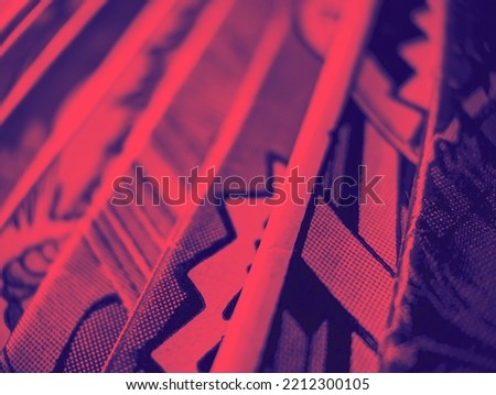 Closeup view of an old comic book collection creates a colorful background paper texture with red and blue duotone effect