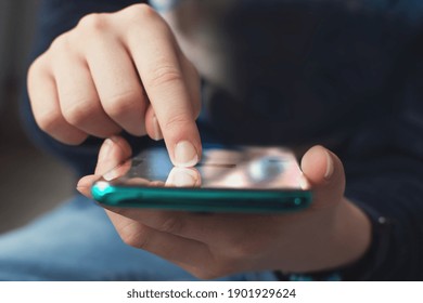 Close-up view on hand and index finger on smartphone. Comunication and technology concept