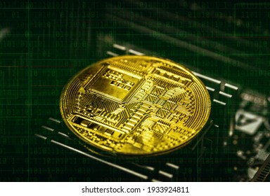 Close-up view on metal physical bitcoin cryptocurrency. BTC placed on top of the motherboard chip. Lots of connections slots and electronical elements around. Binary code with green gradient in the bg