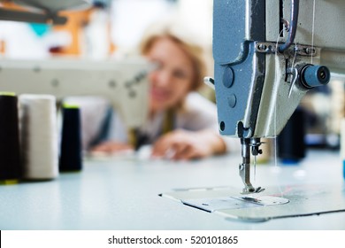 Closeup view on needle with thread in professional sewing machine on factory
