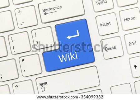 Close-up view on white conceptual keyboard - Wiki (blue key)