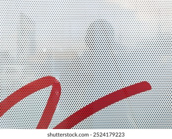 close-up view at One Way Vision sticker film with dot pattern on glass