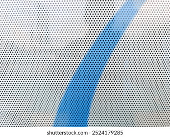 close-up view at One Way Vision sticker film with dot pattern on glass