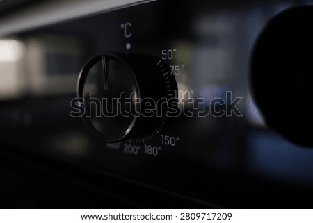 A close-up view of an oven's temperature control knob