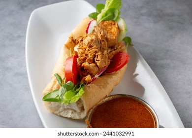 A closeup view of a pan con pollo.