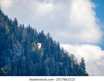 Close-up view of a paraglider soaring over the Swiss Alps - Powered by Shutterstock