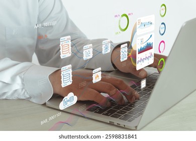 Close-up view of a person working on a laptop with digital data visualization and analytics concept for business intelligence, data analytics,cloud computing,data storage.