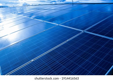 Closeup View Of Photovoltaic Panels Surface Which Installed On The Building's Roof After Washing And Cleaning By The Company's Staffs In The Evening Of The Day.