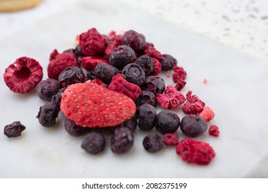 A Closeup View Of A Pile Of Freeze Dried Fruit, Featuring Strawberry, Blueberry And Raspberry.