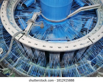 closeup view of polypropylene circular fabric weaving loom machines 
