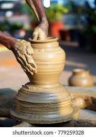   Closeup view of potter making a clay pot                                       