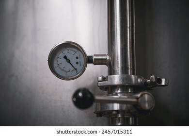 Close-up view of a pressure gauge for measuring and controlling pressure in instruments. - Powered by Shutterstock