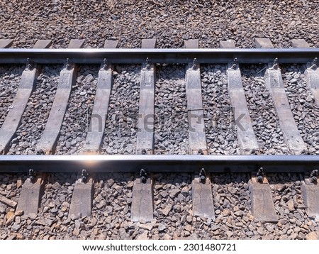 Close-Up View Of Railroad Tracks. Railway sleepers and rails close-up. Iron bolts and connections. Railway background. Railway crossing. rails close up view.