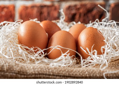 Close-up View Of Raw Chicken Eggs On Wooden Background. Fresh Farm Egg.