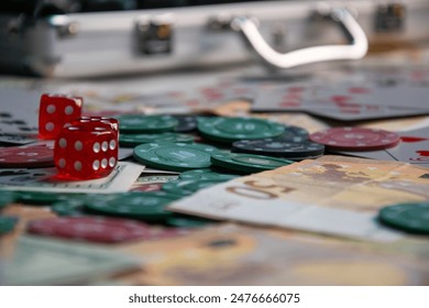 A close-up view of red dice, poker chips, and Euro banknotes scattered on a table. - Powered by Shutterstock