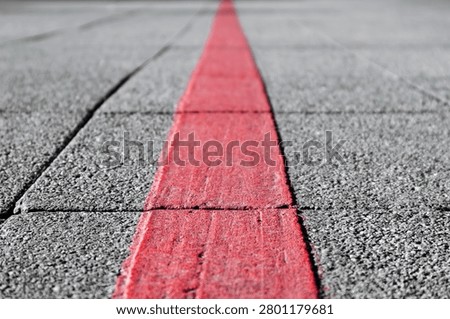 Close-up view of the Red Thread (Roter Faden), the painted tourist route guiding visitors between major landmarks in Hanover