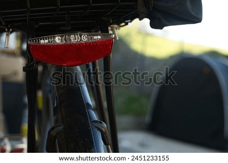Similar – Image, Stock Photo Red bicycle luggage rack and rear light