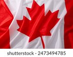 A close-up view of the red and white flag of Canada