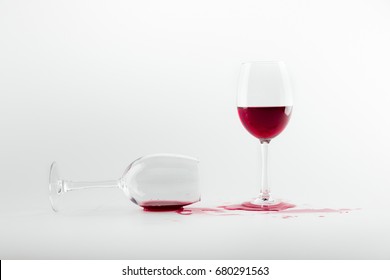 close-up view of red wine in glasses and spilled out isolated on white - Powered by Shutterstock