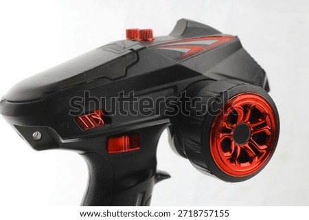 Close-up view of a remote control device for RC toys isolated on a white background. Suitable for electronics, gaming, and hobby concepts.