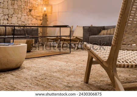 Close-up view of a rustic design chair in an empty hotel room waiting for tourists to return. Tourism concept